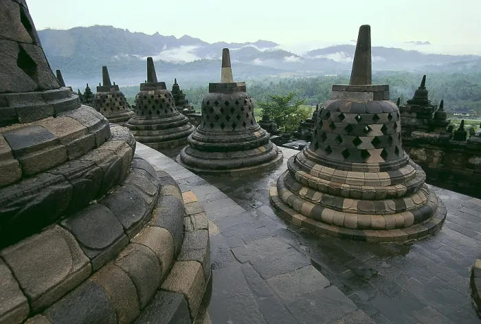 Framed Print : Borobudur Temple. 9th c. INDONESIA. CENTRAL JAVA. Borobudur. Bell-shaped stupas on the roof of the temple. Eastern Art. Architecture