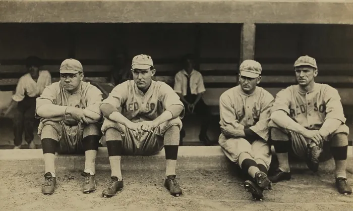 Framed Print : Boston Red Sox players sitting in front of their dugout