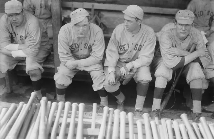 Framed Print : Boston Red Sox players sitting in their dugout, 1915. L-R: Babe Ruth, Bill Carrigan, Jack Barry, Vean Gregg. (BSLOC_2015_17_20)