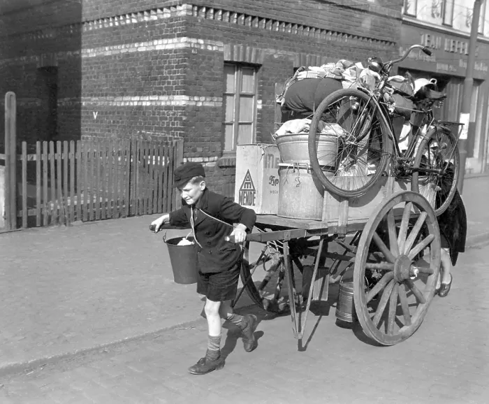 Framed Print : A boy pulls, as his mother pushes, a cart loaded with their possessions in Uerdingen, Germany. U.S Framed Print : A boy pulls, as his mother pushes, a cart loaded with their possessions in Uerdingen, Germany. U.S