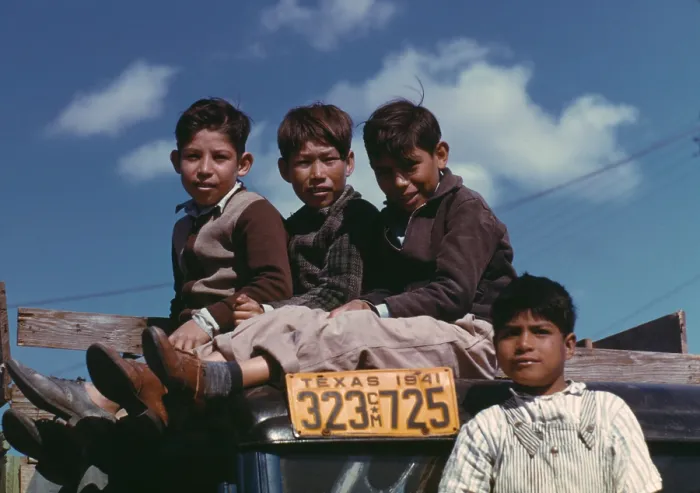 Framed Print : Boys sitting on truck parked at the FSA labor camp. Texas, Jan. 1942. Their families are residents at a U.S