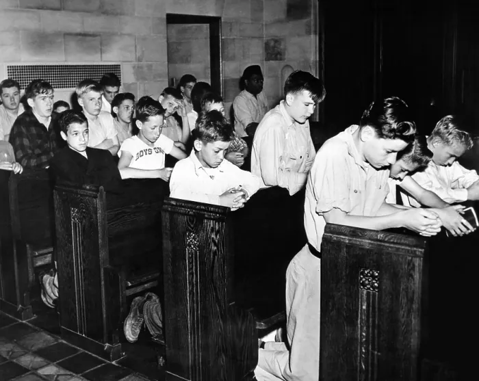 Framed Print : Boys Town citizens bow their heads in prayer for the Father Flanagan. Founder of Boys Town died recently In Germany while inspecting European youth organizations. May 15, 1948