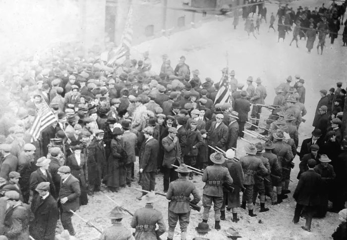 Framed Print : The 'Bread and Roses' strike. National Guardsmen point fixed bayonets at a crowd of strikers during the Lawrence textile mill strike