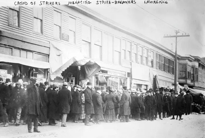 Framed Print : The 'Bread and Roses' strike. Crowd of strikers menacing strike-breakers during the Lawrence textile mill strike. Lawrence, Mass, 1912 Framed Print : The 'Bread and Roses' strike. Crowd of strikers menacing strike-breakers during the Lawrence textile mill strike. Lawrence, Mass, 1912