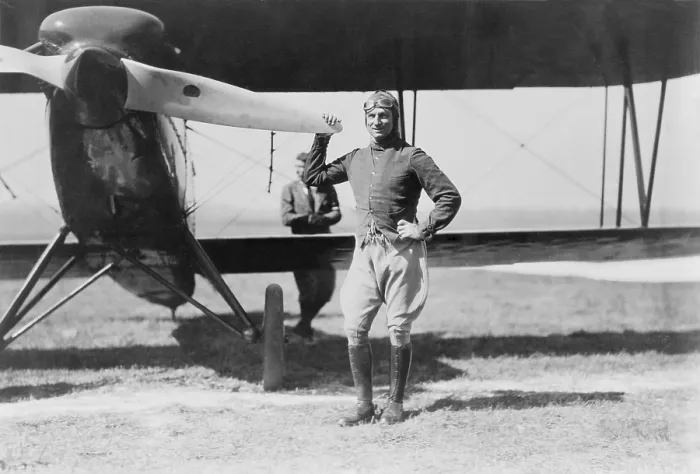 Framed Print : Brigadier General Billy Mitchell, the controversial advocate for military aviation, standing beside a pursuit plane, an early fighter. Ca. 1922