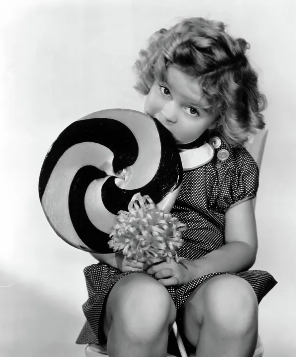 Framed Print : BRIGHT EYES, Shirley Temple, 1934, eating a big lollipop' TM and Copyright (c) 20th Century Fox Film Corp. All rights reserved. Courtesy: Everett Collection
