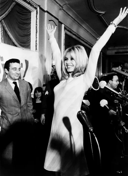 Framed Print : Brigitte Bardot shows her form for newsmen at her press conference at the Plaza Hotel. Dec. 17, 1965