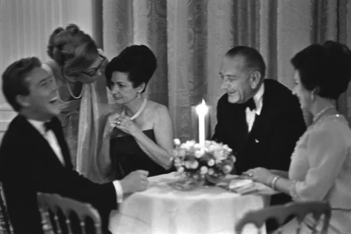 Framed Print : British Royals at the White House. L-R: Lord Snowden (laughing), Lady Bird Johnson, President Lyndon Johnson, Princess Margaret at a small table. Nov. 17, 1965