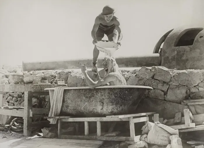 Framed Print : British soldier gives thumbs up for a bath near a coastal gun in the Western Desert. Ca. 1940-42 during World War 2. (BSLOC_2013-12_52)
