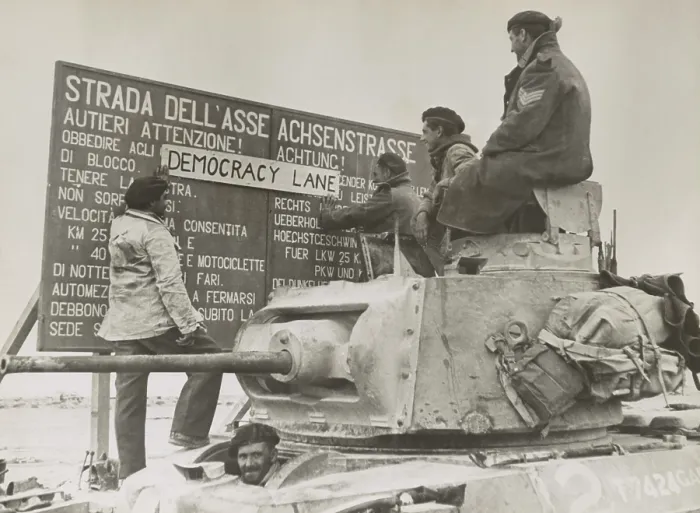Framed Print : After the British victory at El Alamein, a British tank crew alters an Italian-German language sign