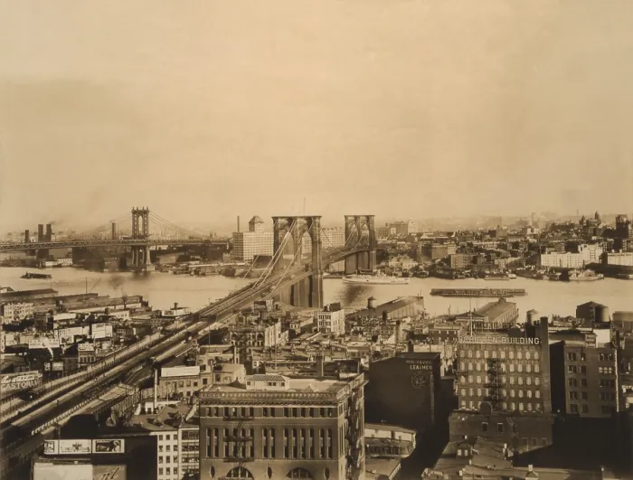 Framed Print : Brooklyn and Manhattan Bridges span the East River 1919. Brooklyn is in the distance and bridge's roadway penetrates several blocks into Manhattan (BSLOC_2018_2_168)
