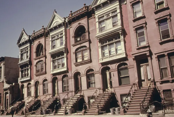 Framed Print : Brownstone apartments under renovation in Brooklyn. The turn of the century buildings are faced with brown sandstone. Ca. 1973-75 Framed Print : Brownstone apartments under renovation in Brooklyn. The turn of the century buildings are faced with brown sandstone. Ca. 1973-75
