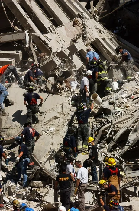 Framed Print : A bucket brigade works to carefully clear debris of the World Trade Center, Sept. 14, 2001