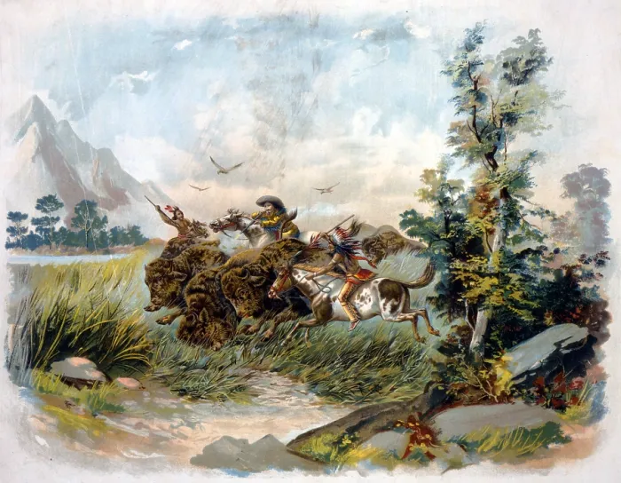 Framed Print : Buffalo hunt in the wild west. A buffalo hunter shooting a buffalo as two Natives ride alongside with spears. chromolithograph. c1897 Framed Print : Buffalo hunt in the wild west. A buffalo hunter shooting a buffalo as two Natives ride alongside with spears. chromolithograph. c1897