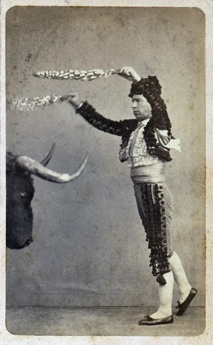 Framed Print : Bullfighting. Occupational portrait of a matador aiming banderillas at a stuffed bull's head. Carte de visite, ca. 1860-1890