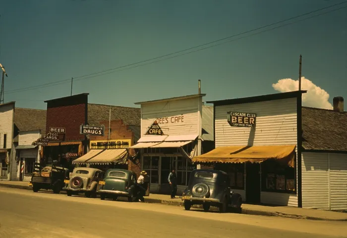 Framed Print : Five businesses on the main street of Cascade Idaho include two bars a cafe drug store and barber shop. 1943 photo by Russell lee. (BSLOC_2010_18_99)