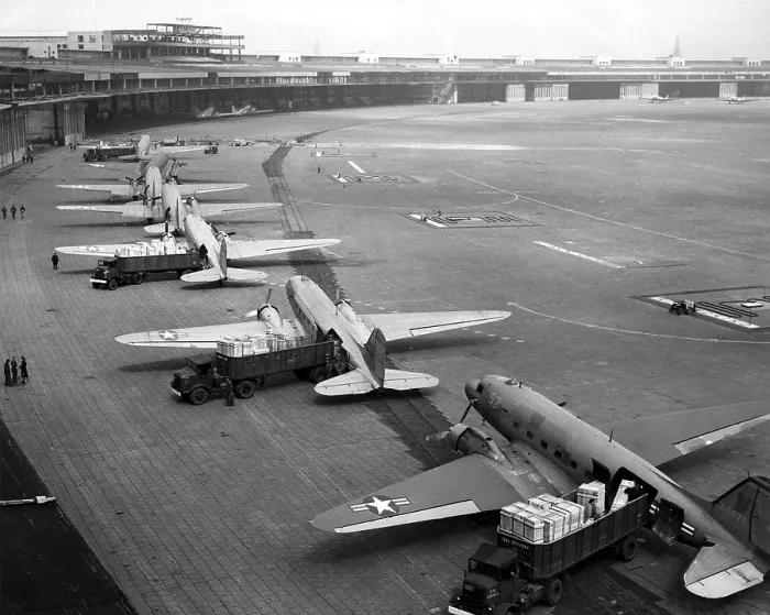 Framed Print : C-47s unloading at Tempelhof Airport during the Berlin Airlift, June-August 1948. In September 1948 they were replaced by larger and faster four-engine C-54s