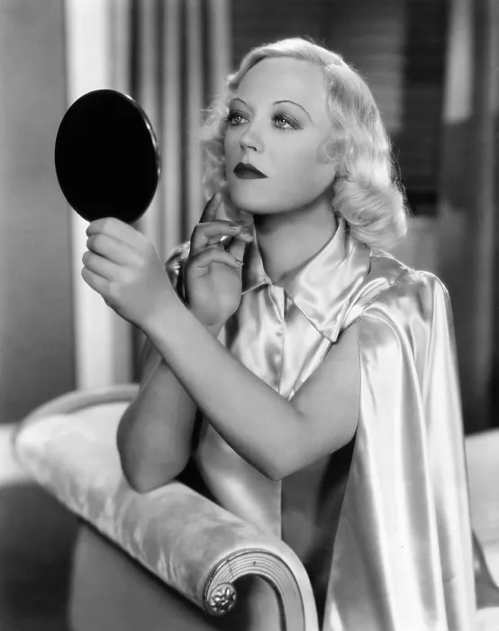 Framed Print : CAIN AND MABEL, Marion Davies checks her makeup on-set, 1936