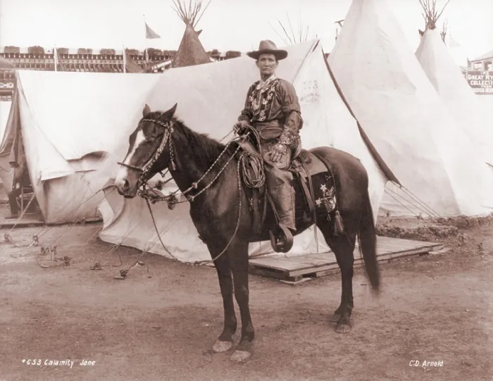 Framed Print : Calamity Jane (1852-1903), posing on horseback. She gained fame in the 1870s and later toured in Wild West shows. Ca. 1885
