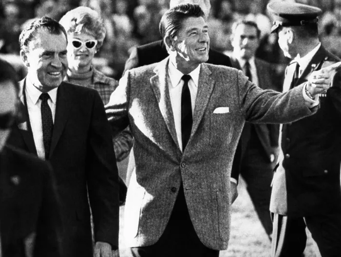 Framed Print : Calif. Governor Ronald Reagan escorts President-elect Richard Nixon across the field at half time of the Rose Bowl game