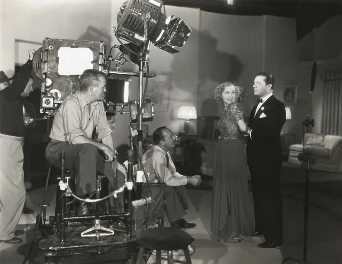 Framed Print : Camera man Don Clark and Director James Tinling film a scene for Change of Heart with Lyle Talbot and Gloria Stuart. 20th Century Fox. Ca. 1938. - (BSLOC_2014_17_123)