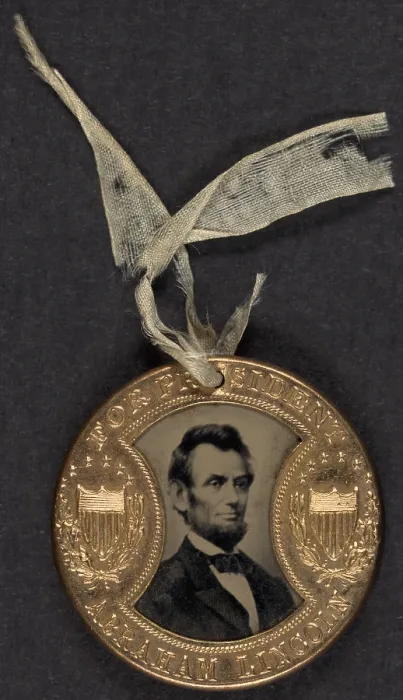 Framed Print : Campaign button for 1864 presidential election showing bust tintype portrait of Abraham Lincoln in a metal casing Framed Print : Campaign button for 1864 presidential election showing bust tintype portrait of Abraham Lincoln in a metal casing