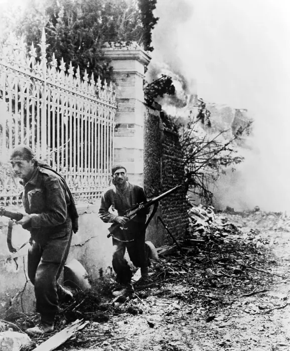 Framed Print : Two Canadian soldiers edge along wall, on the alert for German snipers, near Falaise, France. Ca. August 6-21, 1944. Normandy, World War 2. (BSLOC_2014_10_80)