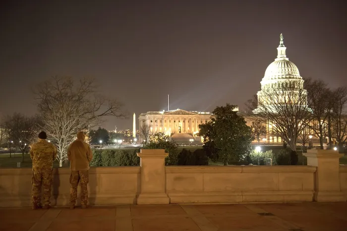 Framed Print : With the capitol in the background, Virginia National Guard soldiers stand guard in Washington, D.C. Jan. 11, 2021 Framed Print : With the capitol in the background, Virginia National Guard soldiers stand guard in Washington, D.C. Jan. 11, 2021