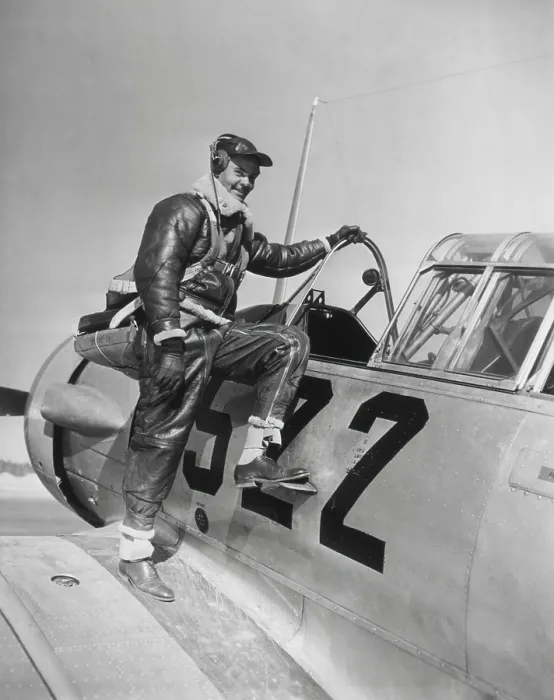 Framed Print : Capt. Benjamin Oliver Davis, Jr. climbing into a Advanced Trainer at Tuskegee, Alabama. January 1942. World War 2. (BSLOC_2013_14_245)