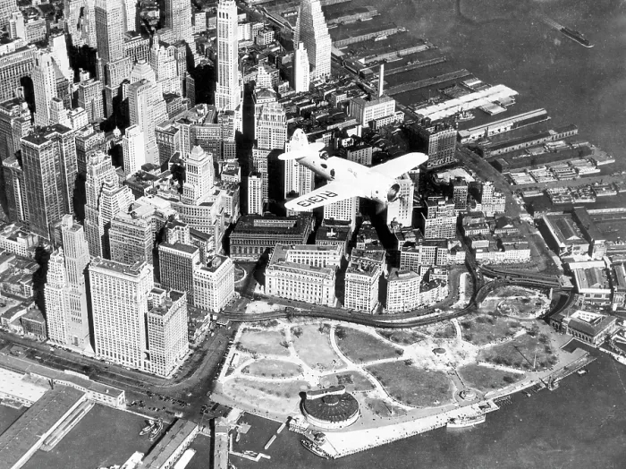 Framed Print : Captain Frank Hawks new Speed Plane flying over Manhattan's financial district and Battery Park, New York City, April 3, 1937. Courtesy: CSU Archives / Everett Collection