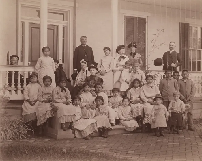 Framed Print : Captain Richard Henry Pratt (standing, left) and students at the Carlisle Indian Industrial School, ca.1890-1900