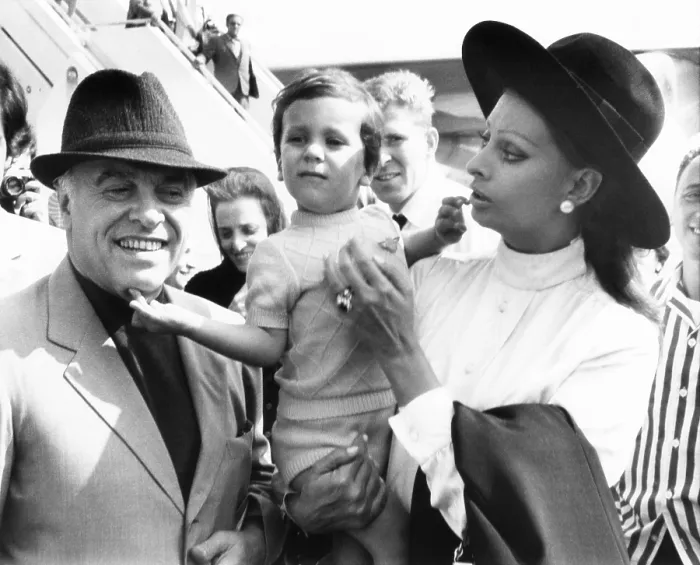 Framed Print : Carlo Ponti, Jr. arrives in New York with his famous parents: Italian film producer, Carlo Ponti Sr. and actress Sophia Loren. Sept. 21, 1970. (CSU_2015_8_616)