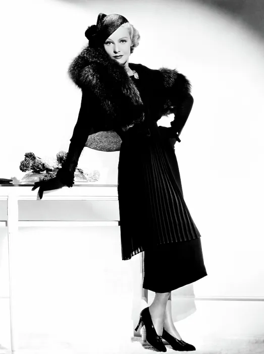 Framed Print : THE CASE AGAINST MRS. AMES, Madeleine Carroll, in a pleated tunic suit trimmed in fox by Helen Taylor, 1936