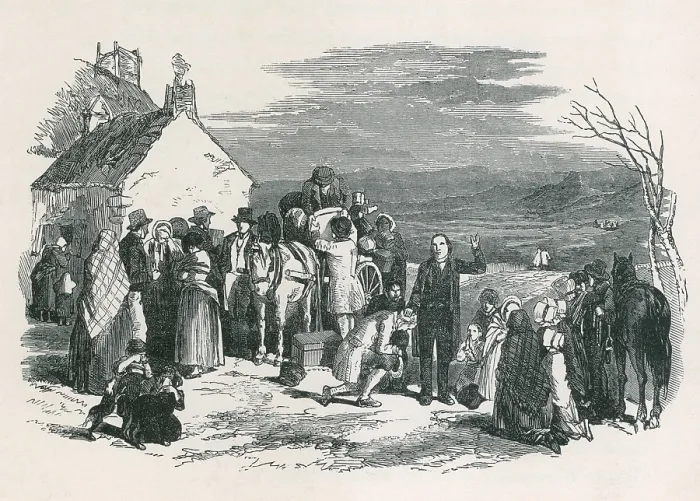 Framed Print : A Catholic priest blesses kneeling immigrants as they to leave their homes and families in Ireland for North America during the potato famine. Ca. 1850