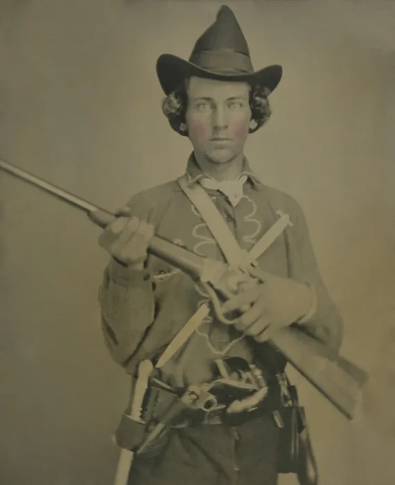 Framed Print : Cavalry soldier wears a Confederate uniform, possibly from Kansas or Missouri. He is armed with a slant breech sharps carbine, two knives, and two revolvers Framed Print : Cavalry soldier wears a Confederate uniform, possibly from Kansas or Missouri. He is armed with a slant breech sharps carbine, two knives, and two revolvers