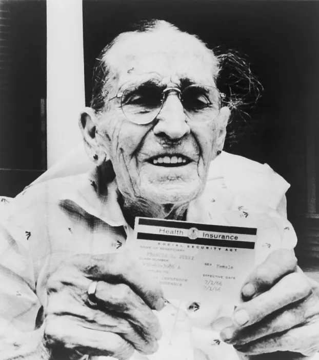 Framed Print : Centenarian Frances Perry holds Medicare card on the first day of the program's operation. Dallas, Texas. July 1, 1966. (BSLOC_2015_14_36) Framed Print : Centenarian Frances Perry holds Medicare card on the first day of the program's operation. Dallas, Texas. July 1, 1966. (BSLOC_2015_14_36)