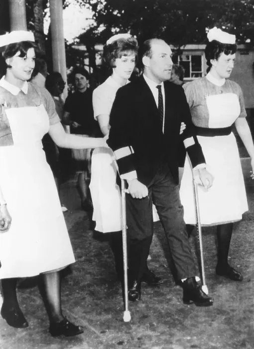 Framed Print : Champion racing driver Sterling Moss on crutches at a British hospital, on June 22, 1962