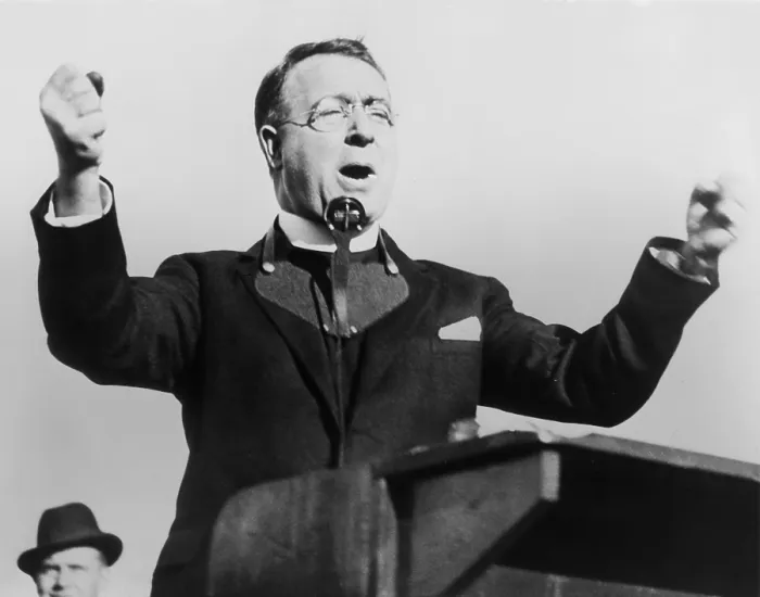 Framed Print : Charles Coughlin, with fists raised, attacks the New Deal in Boston, 1936. Wearing a microphone around his neck, he spoke at the National League baseball field, Boston