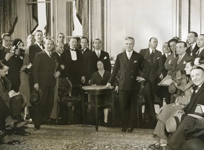 Framed Print : Charlie Chaplin meets with reporters in his living room at the Hotel Crillon, Paris. Ca. 1931. - (BSLOC_2014_14_5) Framed Print : Charlie Chaplin meets with reporters in his living room at the Hotel Crillon, Paris. Ca. 1931. - (BSLOC_2014_14_5)