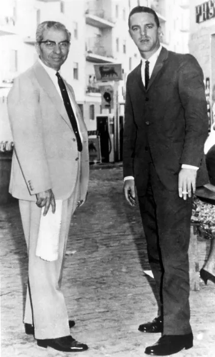 Framed Print : Charlie Lucky Luciano with author Sal Vizzini on via Michelangelo da Caravaggio in Naples, outside Luciano's Royal Art Studio run by his friend Framed Print : Charlie Lucky Luciano with author Sal Vizzini on via Michelangelo da Caravaggio in Naples, outside Luciano's Royal Art Studio run by his friend