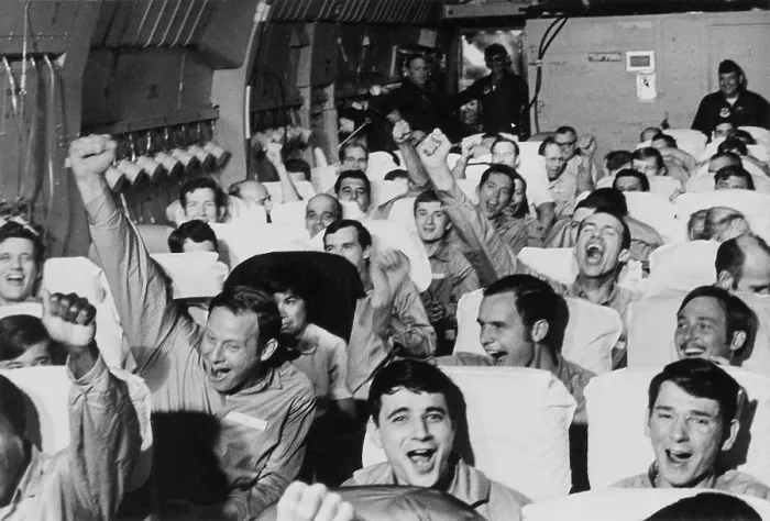 Framed Print : Cheering American POWs. American servicemen cheer as their aircraft takes off from an airfield near Hanoi after their release at the end of the Vietnam War. Ca. Feb Framed Print : Cheering American POWs. American servicemen cheer as their aircraft takes off from an airfield near Hanoi after their release at the end of the Vietnam War. Ca. Feb