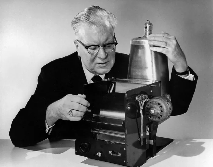 Framed Print : Chester Carlson 1906-1968 with the first model of his invention of 1938 that evolved over 20 years into the Xerox copier. Ca. 1960. (BSLOC_2010_18_180)