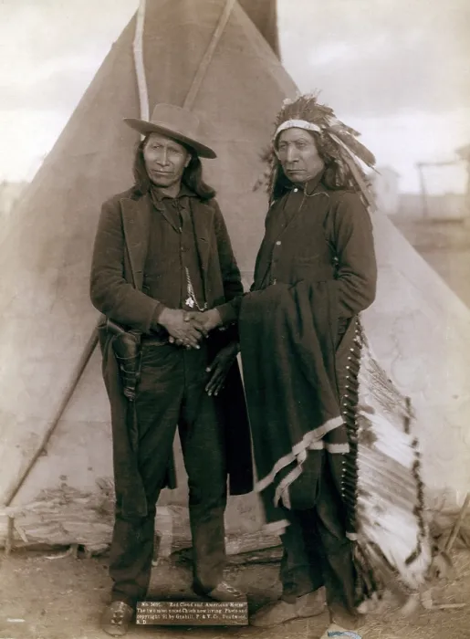 Framed Print : Three Cheyenne men, Standing Elk, No. 1; Running Hog, No. 2; Little Wolf, No. 3, wearing ceremonial clothing and holding rifles with Col. Oelrich, No. 4; Interpreter, No. 5 Framed Print : Three Cheyenne men, Standing Elk, No. 1; Running Hog, No. 2; Little Wolf, No. 3, wearing ceremonial clothing and holding rifles with Col. Oelrich, No. 4; Interpreter, No. 5
