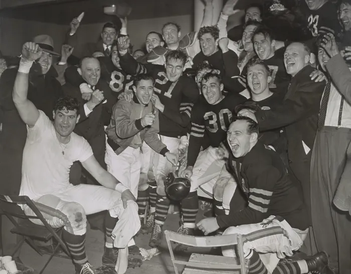 Framed Print : Chicago Bears cheering after beating the Green Bay Packers in the western division playoffs. 2nd from left, standing, is owner-coach George Halas