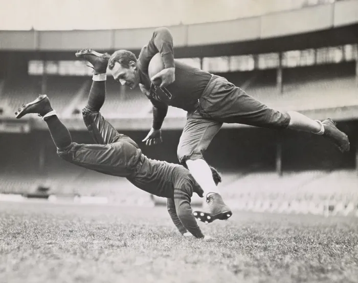 Framed Print : Chicago Bears teammates practicing as Joe Zeller tries to tackle Red Grange. March 18, 1935. - (BSLOC_2015_1_113)