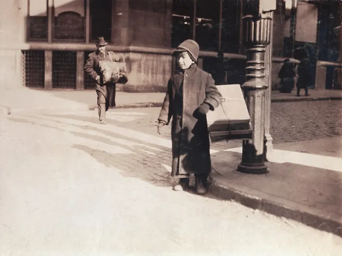 Framed Print : Child labor, ten-year-old child carrying a box of artificial leaves from Leroy Street across Broadway, New York City, photograph by Lewis Wickes Hine, February, 1912