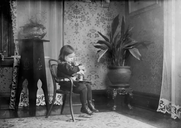 Framed Print : Child putting a Campbell Kid to sleep, photograph by Lewis Wickes Hine, March, 1912 Framed Print : Child putting a Campbell Kid to sleep, photograph by Lewis Wickes Hine, March, 1912