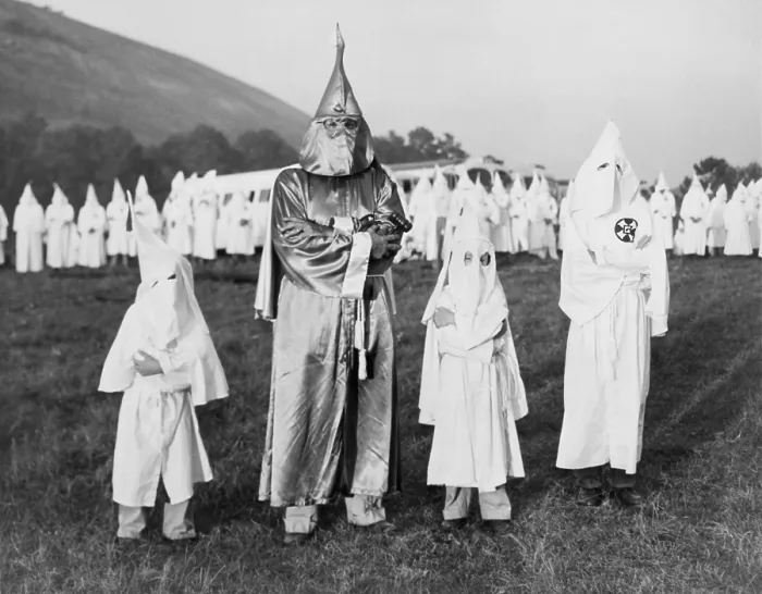 Framed Print : Children in Ku Klux Klan costumes pose with Ku Klux Klan Grand Dragon, Dr. Samuel Green, in Atlanta, Georgia. July 24, 1948 Framed Print : Children in Ku Klux Klan costumes pose with Ku Klux Klan Grand Dragon, Dr. Samuel Green, in Atlanta, Georgia. July 24, 1948