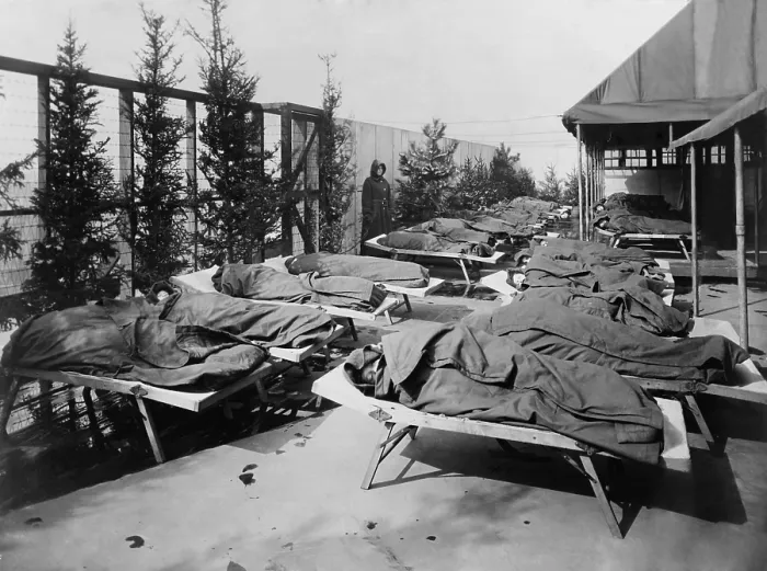 Framed Print : Children lie on cots, wrapped in blankets, on the roof of Hull House Boys Club, c. 1910. The children were in their rest period at Elizabeth McCormick Open Air School No. 2