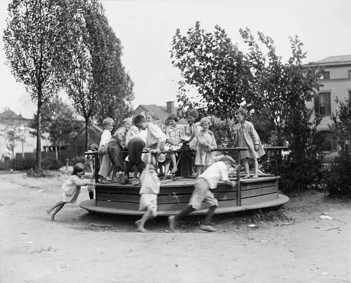 Framed Print : Children playing at a playground, circa 1918-1920